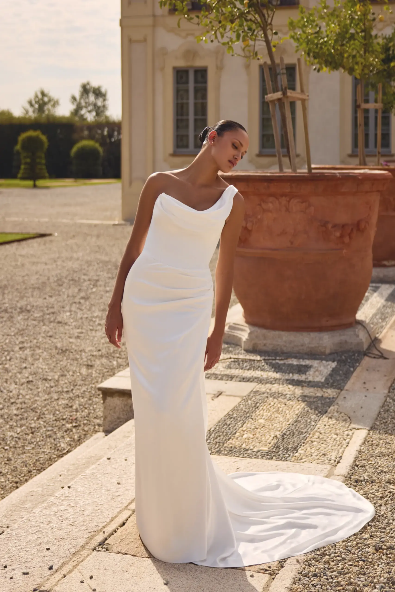 One shoulder fitted silky wedding dress with puddle train