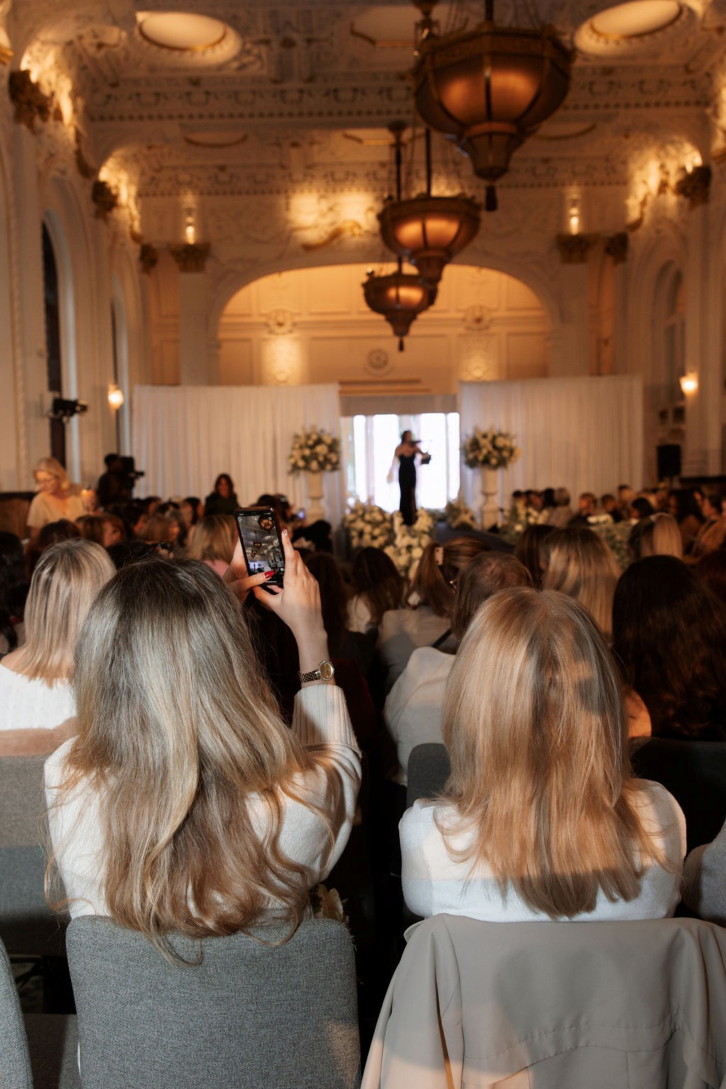 Brides to be watching catwalk event